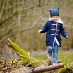 girl walking through the woods